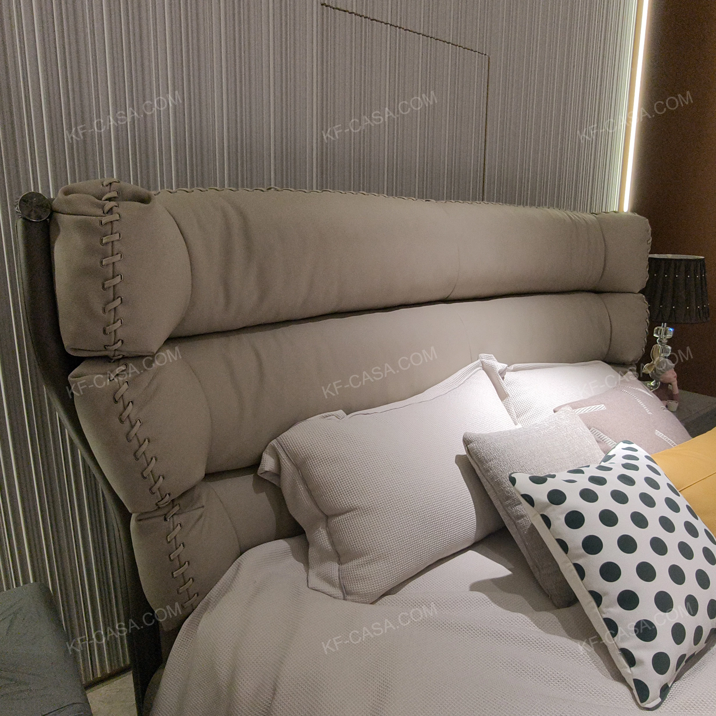 Warm Taupe Upholstered Bed with Tiered Headboard, Lacing Detail & Stainless Steel Accents